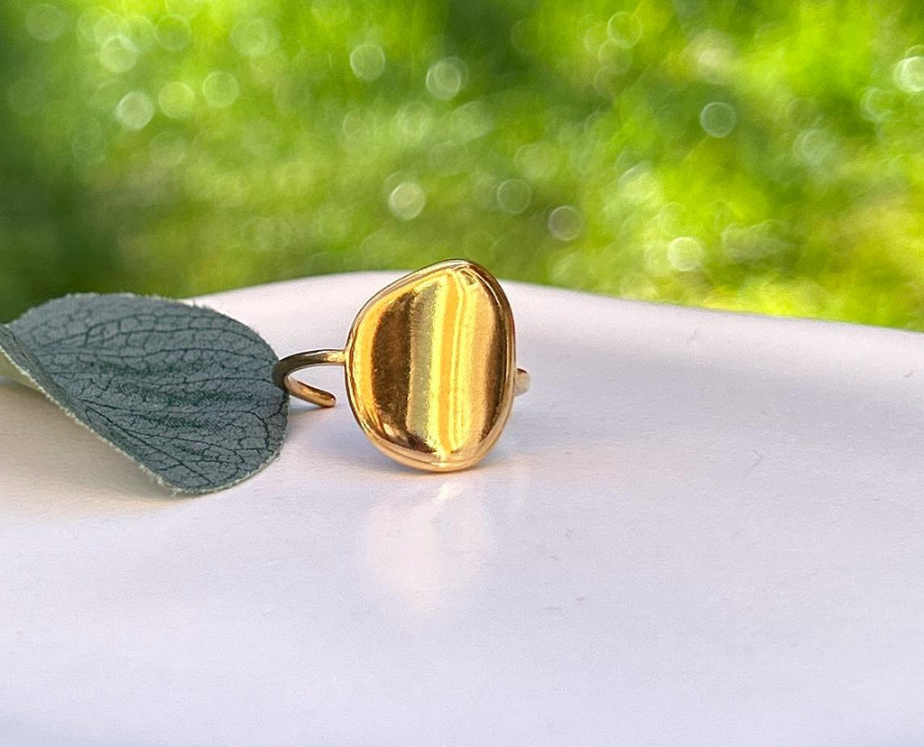 Simple, Chic and Timeless - a Waterproof Gold Ring in an Adjustable Size with a Smooth Gold Disc in an on Trend Irregular Finish